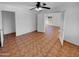 Spacious bedroom with ceiling fan and entry to living area at 12914 W Wilshire Dr, Avondale, AZ 85392