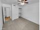 Bedroom with closet and hallway featuring tile floor at 12914 W Wilshire Dr, Avondale, AZ 85392