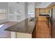 Spacious kitchen with an island, tile flooring, and stainless steel appliances, perfect for entertaining at 12914 W Wilshire Dr, Avondale, AZ 85392