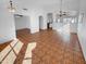 Open-concept living room featuring tile flooring, neutral walls, and view to other rooms at 12914 W Wilshire Dr, Avondale, AZ 85392