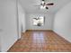 Main bedroom featuring tile flooring and view to the bathroom at 12914 W Wilshire Dr, Avondale, AZ 85392