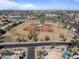 Wide aerial shot capturing the community amenities, including baseball fields, park, and pond at 1313 W Straford Ave, Gilbert, AZ 85233