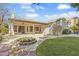 Well-manicured backyard featuring covered patio and lush lawn at 1313 W Straford Ave, Gilbert, AZ 85233