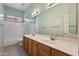 Bathroom featuring a double sink vanity and a separate toilet and bathtub area at 1313 W Straford Ave, Gilbert, AZ 85233