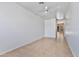 Bright room featuring tile floors, a ceiling fan, and neutral walls at 1313 W Straford Ave, Gilbert, AZ 85233