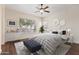 Bright bedroom features a large window, modern decor, and hardwood flooring at 1313 W Straford Ave, Gilbert, AZ 85233