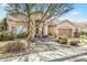 Charming single-story home with desert landscaping, walkway and covered entry at 1313 W Straford Ave, Gilbert, AZ 85233