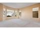 Serene living room features neutral carpet, ample natural light from several windows, and a relaxing atmosphere at 1313 W Straford Ave, Gilbert, AZ 85233