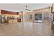 Open concept living space integrates kitchen with stainless appliances, dining, and living area, complete with tiled floors at 1313 W Straford Ave, Gilbert, AZ 85233
