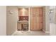 Built-in cabinets and desk in office nook with tile floors at 1313 W Straford Ave, Gilbert, AZ 85233