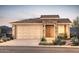 Charming single-story home featuring a stone facade, tile roof, and well-manicured landscaping at 13582 W Calle De Pompas --, Peoria, AZ 85383