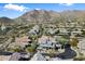 Picturesque aerial view of luxury homes in the mountains with desert landscaping at 13662 E Shaw Butte Dr, Scottsdale, AZ 85259