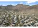 Aerial view of a residential area in the mountains on a clear day at 13662 E Shaw Butte Dr, Scottsdale, AZ 85259