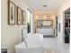 Bathroom featuring a modern freestanding tub, dual vanity with marble countertop and a large window at 13662 E Shaw Butte Dr, Scottsdale, AZ 85259