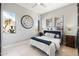 Bedroom with a large decorative clock, neutral walls and abundant natural light at 13662 E Shaw Butte Dr, Scottsdale, AZ 85259