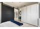 Bedroom featuring a dark sliding door closet and decorative lighting at 13662 E Shaw Butte Dr, Scottsdale, AZ 85259