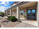 Inviting front entrance featuring manicured landscaping, double doors, and covered porch at 13662 E Shaw Butte Dr, Scottsdale, AZ 85259