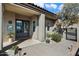 Inviting front entrance featuring manicured landscaping, double doors, and covered porch at 13662 E Shaw Butte Dr, Scottsdale, AZ 85259