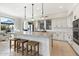 Spacious kitchen with a large island, stainless appliances, and ample cabinet space at 13662 E Shaw Butte Dr, Scottsdale, AZ 85259