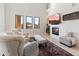 Bright living room features a fireplace, high ceilings and an open floor plan at 13662 E Shaw Butte Dr, Scottsdale, AZ 85259