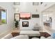 Bright living room features a fireplace, high ceilings and an open floor plan at 13662 E Shaw Butte Dr, Scottsdale, AZ 85259