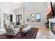 Bright living room features a fireplace, high ceilings and an open floor plan at 13662 E Shaw Butte Dr, Scottsdale, AZ 85259
