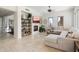 Open living room boasts a fireplace, large sectional sofa, and bright windows at 13662 E Shaw Butte Dr, Scottsdale, AZ 85259