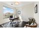 Bright office features a modern desk, chairs, and mountain views from a large window at 13662 E Shaw Butte Dr, Scottsdale, AZ 85259