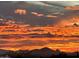 Scenic sunset view with vibrant orange and purple hues over mountain silhouettes at 13662 E Shaw Butte Dr, Scottsdale, AZ 85259