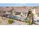 Beautiful aerial view of home featuring backyard pool, desert landscape, and community at 15313 S 180Th Ave, Goodyear, AZ 85338