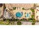 Aerial view of an outdoor oasis featuring a pool, pergola, and travertine patio at 15313 S 180Th Ave, Goodyear, AZ 85338