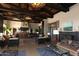Spacious clubhouse with beamed ceilings, large windows, and comfortable seating areas at 15313 S 180Th Ave, Goodyear, AZ 85338