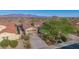 Desert home with mature landscaping, spacious driveway and mountain views at 15313 S 180Th Ave, Goodyear, AZ 85338