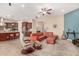 Spacious open-concept living area featuring an oversized sectional and kitchen with island seating at 15313 S 180Th Ave, Goodyear, AZ 85338
