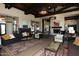 An open lobby features comfortable seating, ornate lighting, and a fireplace at 15313 S 180Th Ave, Goodyear, AZ 85338