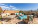 Cozy outdoor living space with comfortable seating surrounding a fire pit, perfect for relaxation at 15313 S 180Th Ave, Goodyear, AZ 85338