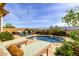 Resort style pool deck features lounge chairs, lush landscaping, and desert views at 15313 S 180Th Ave, Goodyear, AZ 85338