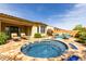 Resort style pool deck and patio with built in hot tub and plenty of seating at 15313 S 180Th Ave, Goodyear, AZ 85338