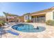 Custom designed pool and patio, accented with a pergola and blue accents, perfect for outdoor enjoyment at 15313 S 180Th Ave, Goodyear, AZ 85338