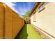 Side yard featuring a putting green for golfers of all skill levels at 15313 S 180Th Ave, Goodyear, AZ 85338