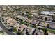 An aerial view of the neighborhood showcasing well-maintained homes with desert landscaping and community streets at 15442 W Sells Dr, Goodyear, AZ 85395