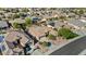 Aerial view of home with pool, landscaped yard, and solar panels in a desert community at 15442 W Sells Dr, Goodyear, AZ 85395