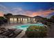 Resort-style backyard featuring a refreshing swimming pool, lounge chairs, and a relaxing hot tub at 15442 W Sells Dr, Goodyear, AZ 85395