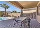Inviting backyard patio with outdoor seating, grill, and pool, perfect for entertaining at 15442 W Sells Dr, Goodyear, AZ 85395