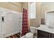 Clean bathroom featuring a shower, toilet, and sink with modern fixtures and neutral colors at 15442 W Sells Dr, Goodyear, AZ 85395
