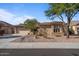 Charming single-story home with desert landscaping, neutral stucco, and a spacious two-car garage at 15442 W Sells Dr, Goodyear, AZ 85395