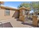 Warm and inviting front porch showcasing desert landscaping and wrought iron accents at 15442 W Sells Dr, Goodyear, AZ 85395