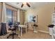 Functional home office with natural light, desk, and office chairs, ideal for work or study at 15442 W Sells Dr, Goodyear, AZ 85395