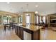 A beautiful kitchen island with granite counters and stainless steel dishwasher at 15442 W Sells Dr, Goodyear, AZ 85395