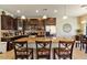 A spacious kitchen featuring a granite countertop island and stainless steel appliances at 15442 W Sells Dr, Goodyear, AZ 85395